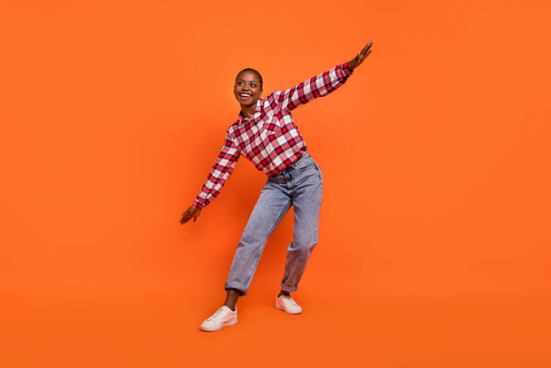 Full length photo of cheerful nice person dancing chilling spend pastime isolated on orange color background. - Fotografie, Obrázek
