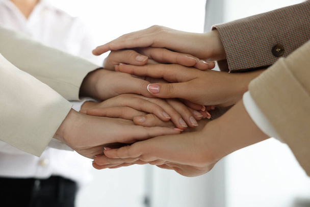 Group of people holding hands together indoors, closeup. Unity concept - Foto, Bild