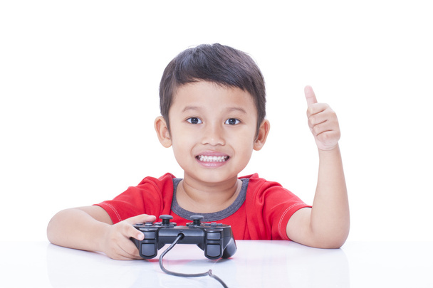 Boy playing video game with glasses - Zdjęcie, obraz