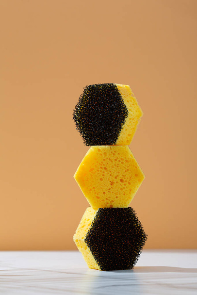A Pile Of Kitchen Black and Yellow Sponges - Фото, изображение
