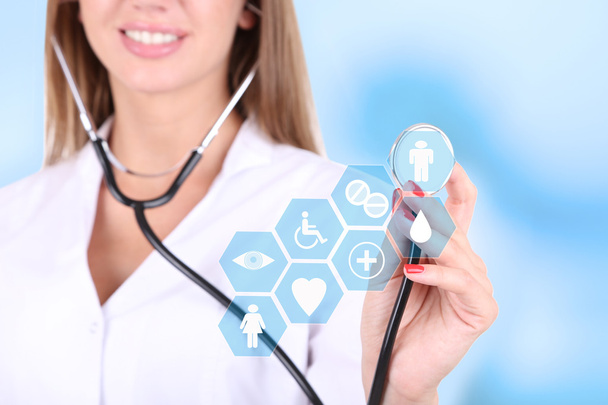 Female doctor with stethoscope and virtual screen - Photo, Image