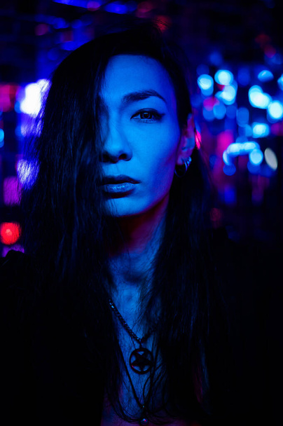 Portrait of a transgender model in a studio with neon lighting - Foto, imagen