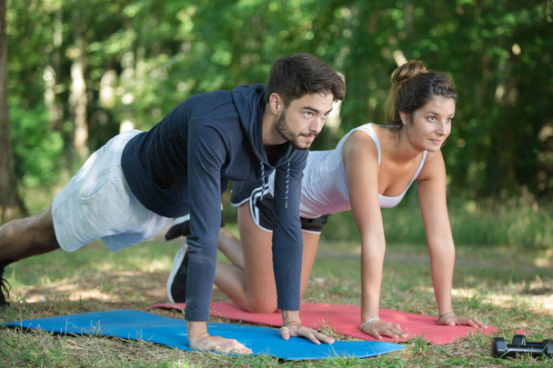 couple doing workout together in park - Foto, immagini