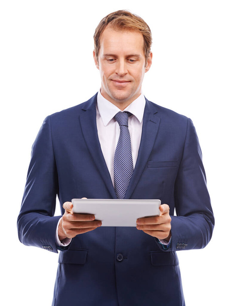 A world of resources in my hands. A studio shot of a businessman using a tablet - Foto, Imagen