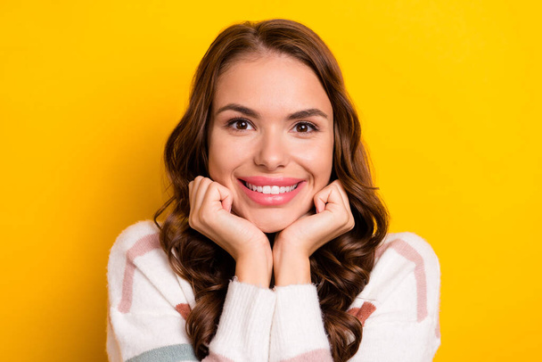 Photo of stunning satisfied person arms touch cheeks beaming smile isolated on yellow color background. - 写真・画像