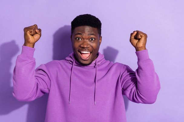 Portrait of attractive cheerful lucky guy rejoicing having fun great luck isolated over bright violet lilac color background. - Fotografie, Obrázek