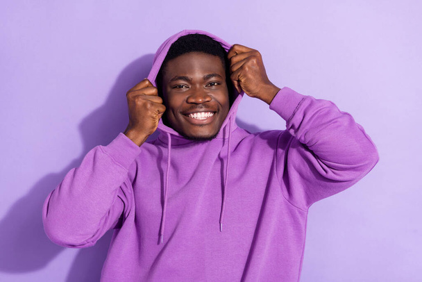 Portrait of attractive cheerful brunet guy wearing cosy clothes isolated over bright violet lilac color background. - Фото, зображення