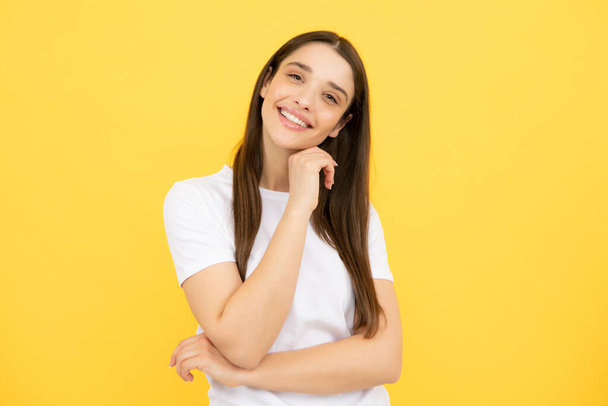 Happy smiling woman portrait. Attractive young pretty cheerful girl in casual clothing feeling happy and carefree, isolated background - Zdjęcie, obraz