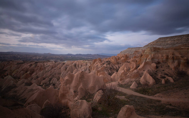 Beautiful mountains and Red valley at sunset in Goreme, Cappadocia in Turkey. - Photo, Image