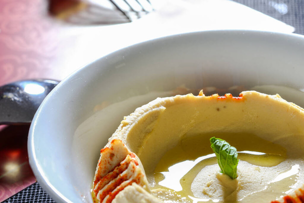 HUMMUS served in dish close up side view of arab food - Foto, Imagen