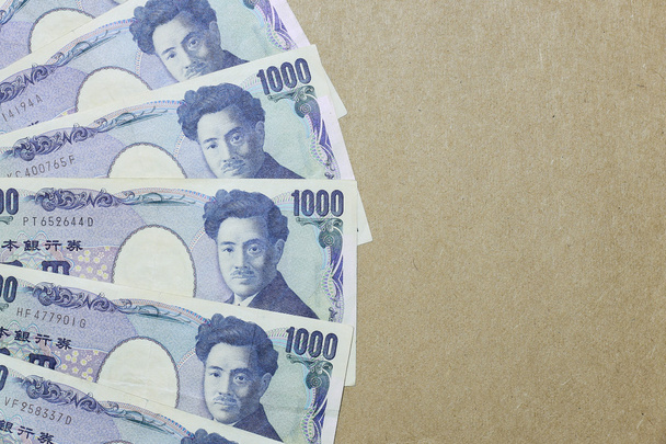 iene japonês sobre fundo de papel marrom
 - Foto, Imagem