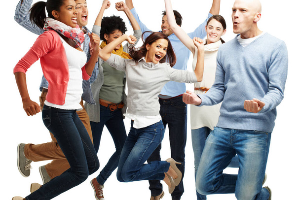 Saltar de alegria. Estúdio de um grupo diversificado de jovens vibrantes pulando no ar isolado em branco - Foto, Imagem