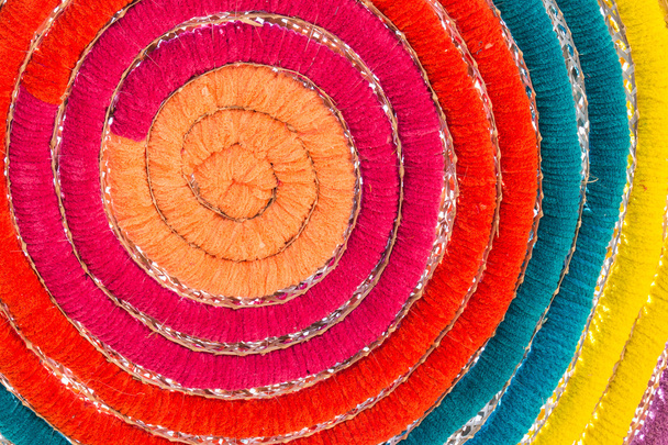 Colorful silk turnovers in the rolling round - 写真・画像