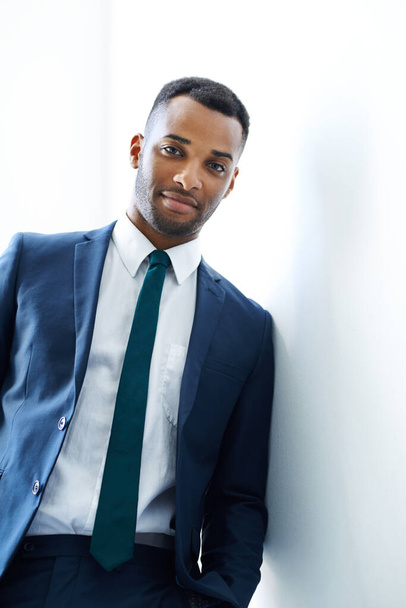 Confident hell get the next promotion. A handsome young african american businessman standing indoors - Photo, Image