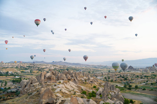 beautiful scenery flight of balloons in the mountains of Cappadocia - Photo, Image
