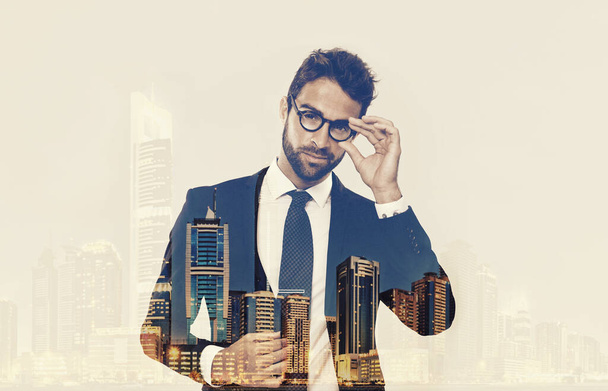 I love the nightlife...Composite image of a well-dressed man superimposed on an image of a city at night - Foto, afbeelding
