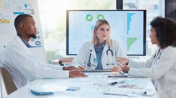Doctors, meeting or teamwork collaboration on data paper, infographic digital screen chart or finance funding documents. Communication or medical healthcare people planning hospital surgery insurance. - Photo, Image