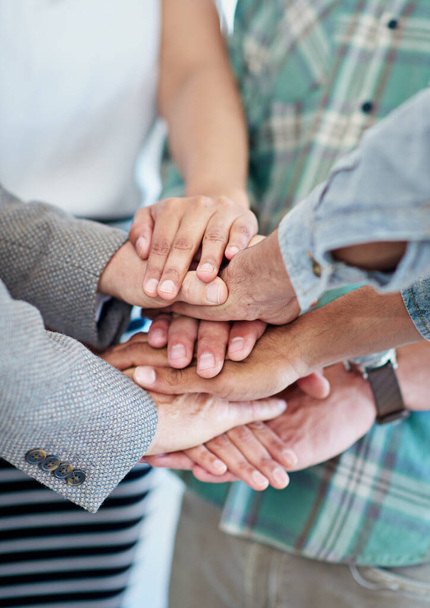Together, we make the best team. a group of coworkers with their hands in a huddle - Foto, Bild