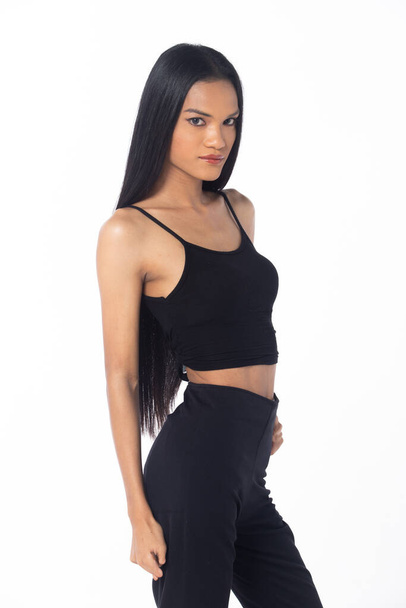 Half body tanned skin women with disability of young adult stand confident, white background. Asian female long straight hair smile in black shirt dress pant  - Photo, Image