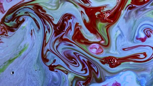 Difusión de tinta de pintura abstracta en la superficie lechosa  - Metraje, vídeo