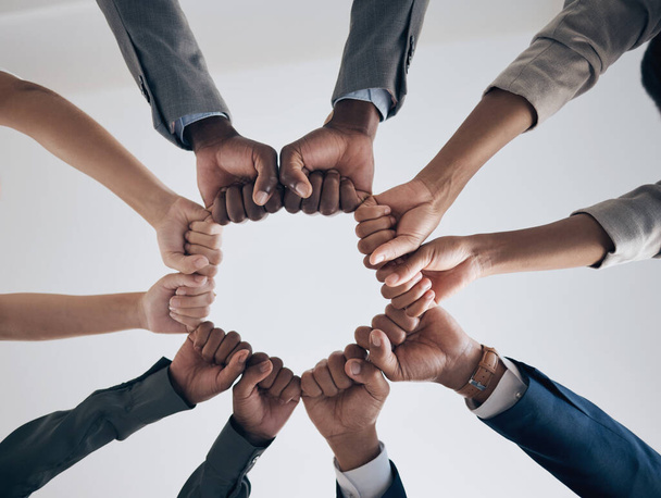 Team, motivation and support with hands fist bump of corporate partnership office workers. Work community, goal success and collaboration hand sign of business employee group teamwork together. - Φωτογραφία, εικόνα
