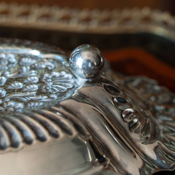 antique silver tray. engraved metal tray in a sophisticated interior. metal close-up - Photo, Image