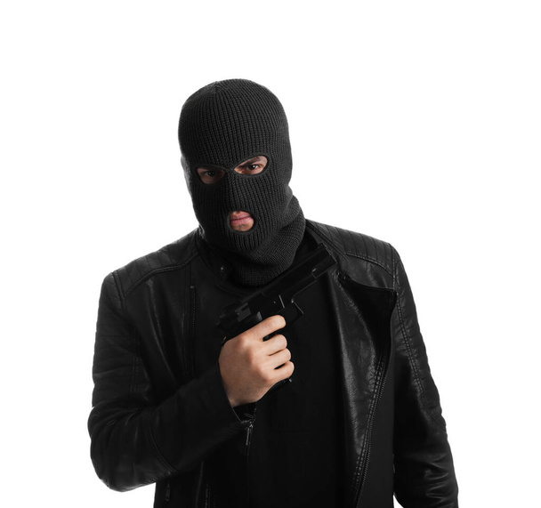 Man wearing knitted balaclava with gun on white background - Zdjęcie, obraz