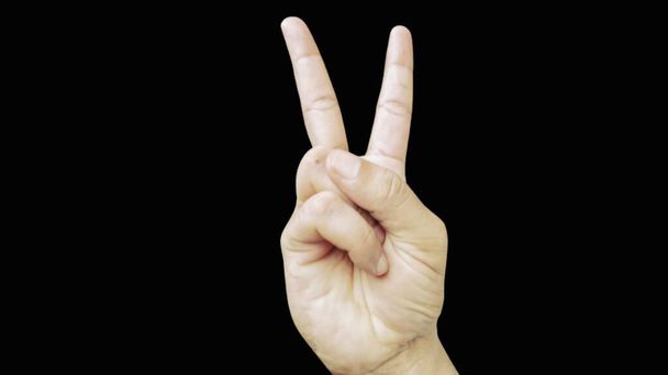 Victory peace sign symbol two fingers raised by human showing making v-sign  - Foto, immagini
