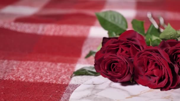 Romantic and cozy Valentines Day at home in bed with red flowers roses, candles and coffee. Surprise for a loved one on a special day - Footage, Video