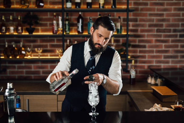 barman prepares cocktail in club - Fotó, kép