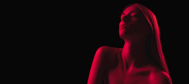 Beautiful, mysterious, mystical model. Monochrome. Dark red night. Young sensual woman in neon light on dark background. Cyberpunk style, beauty, halloween concept. - Foto, Imagem