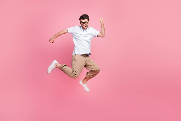 Full length photo of glad satisfied man rejoice career promotion boss chief position empty space isolated on pink color background. - Fotografie, Obrázek
