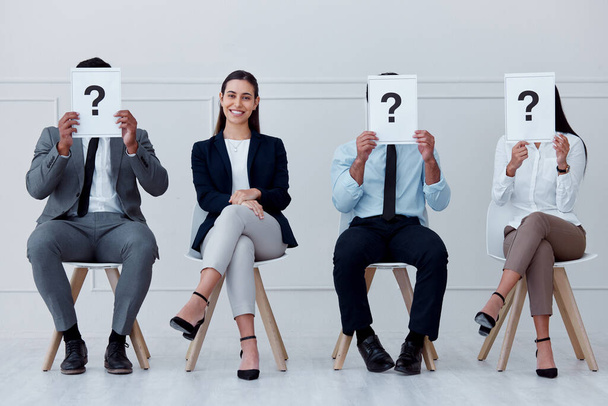 Job interview, question mark and feedback with business people sitting with sign for review, recruitment and search. Why, faq and hiring with employees holding icon for opinion, vote or policy. - Foto, Bild