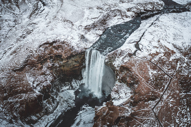 Skogafoss Waterfall in Iceland a Beautiful Landmark Covered in Snow - Fotoğraf, Görsel
