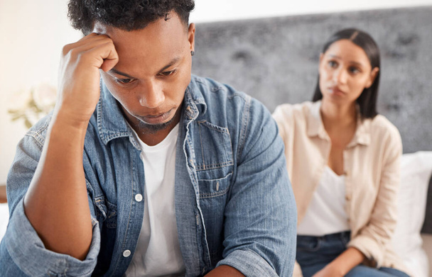 Problem, fight and depressed couple argue in bedroom at home together for cheating, divorce or mental health. Angry, sad or fail with frustrated man ignoring woman in toxic relationship. - Fotó, kép