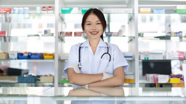 Pharmacist working in a pharmacy, Consultation and medical advice, All kinds of generic household drugs and pharmaceutical products on the shelf, Service and assistance to patients, Pharmacy. - Photo, Image