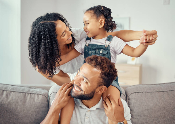 Black family or mother, father and child on sofa together for happiness, love and care. Happy group of people parents or mom, dad and girl kid on living room couch for home growth development. - Photo, Image