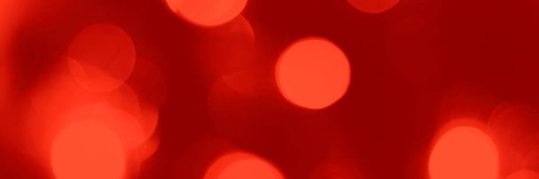 Blurred lights red background, banner texture. Abstract bokeh with soft light header. Wide screen wallpaper. Panoramic web banner with copy space for design - Photo, Image