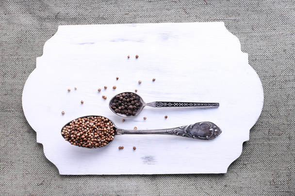 Seasonings in metal spoons - Foto, Bild