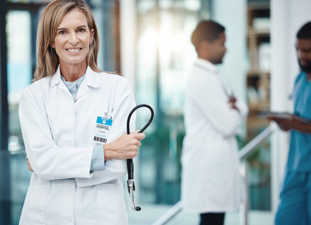 Cardiology, stethoscope and proud doctor in portrait for medical wellness, trust and innovation with lens flare. Hospital executive healthcare worker woman smile for career motivation or heart health. - Foto, Bild