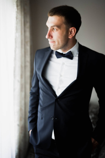 Beautiful man, groom posing and preparing for wedding. - Foto, Bild