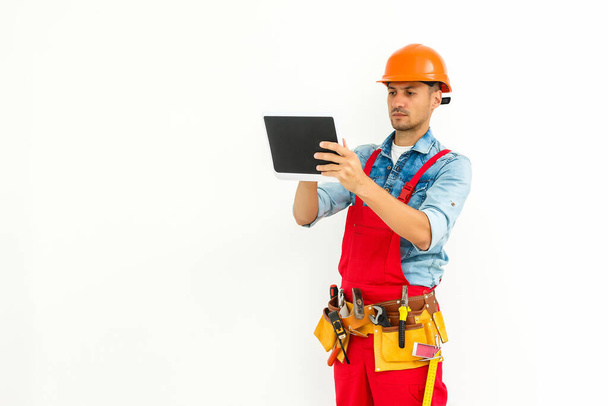 Cheerful Technician Holding tablet Over White Background - Photo, Image