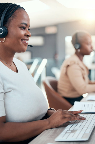Black woman, call center and contact us teamwork in office for crm consulting, help or customer support. Happy smile receptionist, telemarketing consultant or sales women working in b2b communication. - Photo, Image