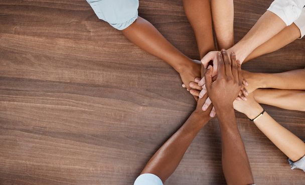 Diversity, teamwork and hands together at table in office with corporate company people mock up. Trust, support and respect in business with diverse people working on collaboration in workplace - 写真・画像