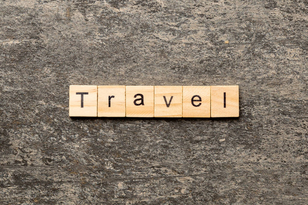 Travel word written on wood block. Travel text on cement table for your desing, concept. - Photo, Image