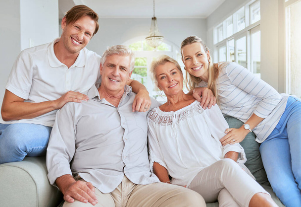 Family portrait in living room or parents house with women, men and happy senior retirement couple. Happiness, love and care for grandparents in summer holiday house with lens flare for mental health. - Fotografie, Obrázek