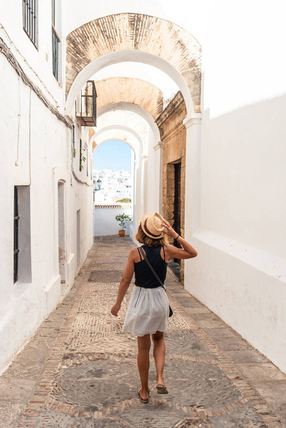 A young tourist visiting the historic center of Vejer de la Frontera, Cadiz. Andalusia - Zdjęcie, obraz