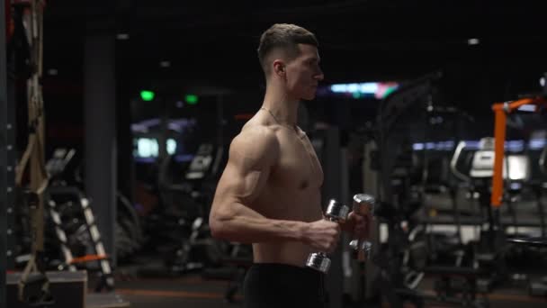 strong athlete training in sport gym with barbell. sport athlete with barbell in gym. athlete with sport barbell equipment in gym - Footage, Video