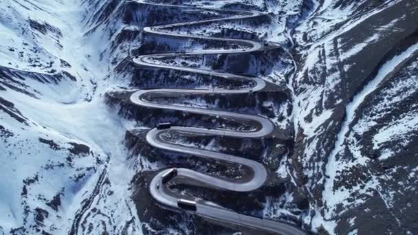 Famous winding road at Andes Mountains. Los Caracoles highway road near Santiago Chile. Snowing scenery. Snow highway road. Winding curves background near Argentina and Chile border. - Footage, Video