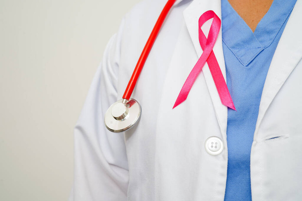 Asian woman doctor with pink ribbon, World Breast Cancer Day at October. - Zdjęcie, obraz